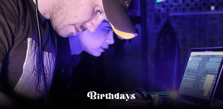 Two people working on a laptop.